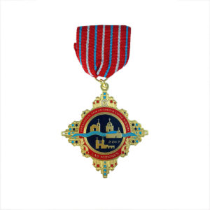 A medal with a red and blue ribbon.