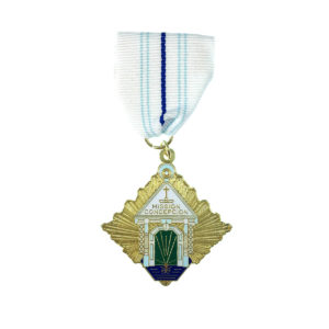 A medal with a house on it