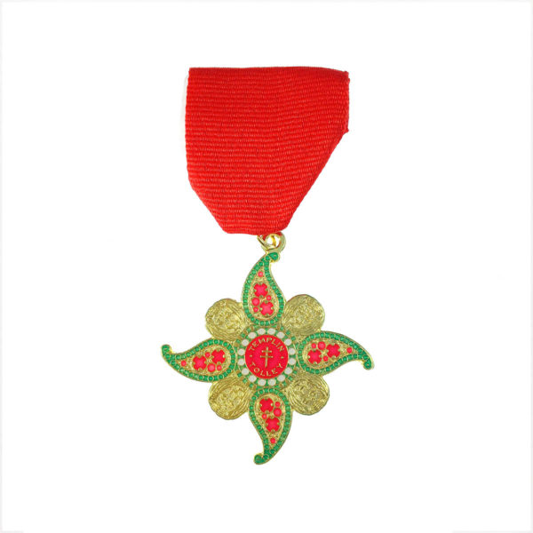 A red and green medal with a gold star.