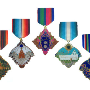 A group of medals hanging from ribbons.