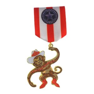 A medal with a monkey wearing a cowboy hat.