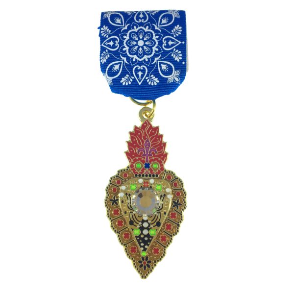 A medal with a blue ribbon and a red heart.