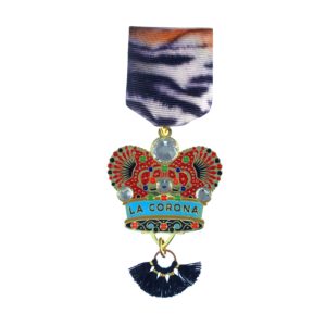 A medal with a crown and tassels on it.