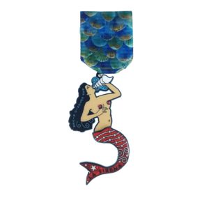 A mermaid holding a star and standing on top of a medal.