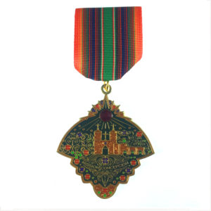 A medal with a castle on it