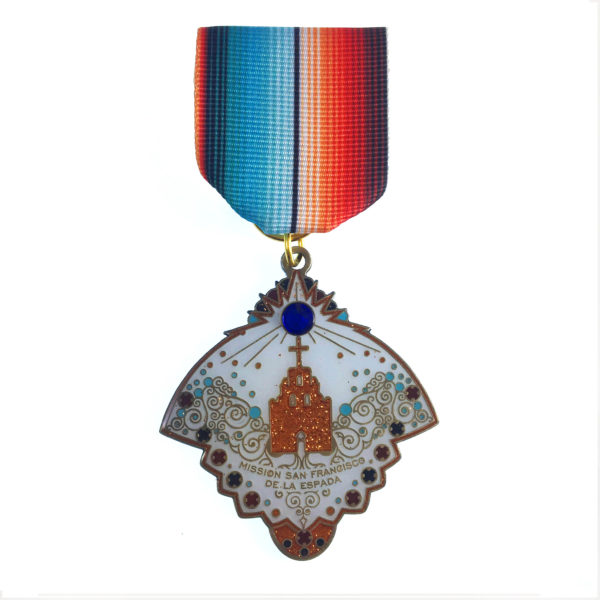 A medal with a blue and red stripe on it.