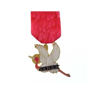 A red ribbon with a crane on it