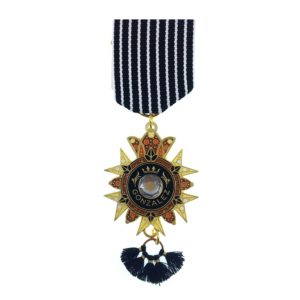 A medal with a black and gold ribbon hanging from the top.