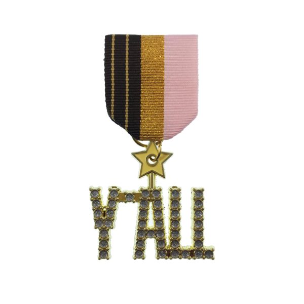 A medal with the word " y ' all " on it.