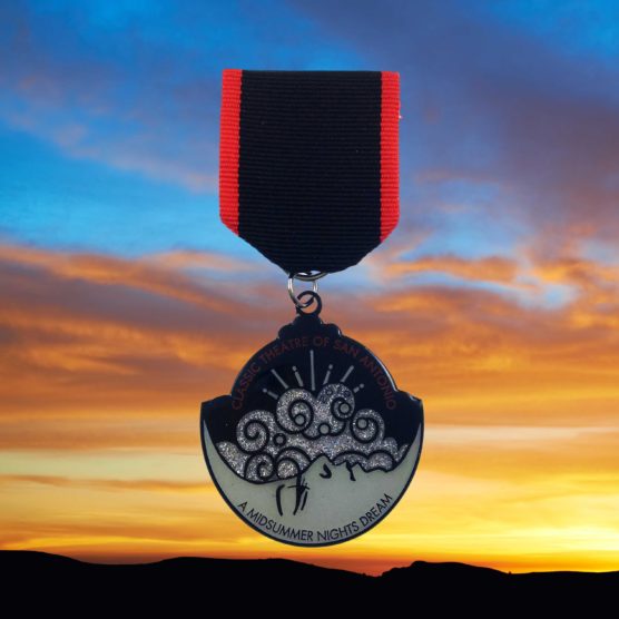 A medal hanging from the side of a sky background