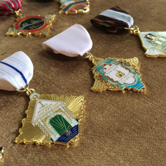 A close up of some medals on a table