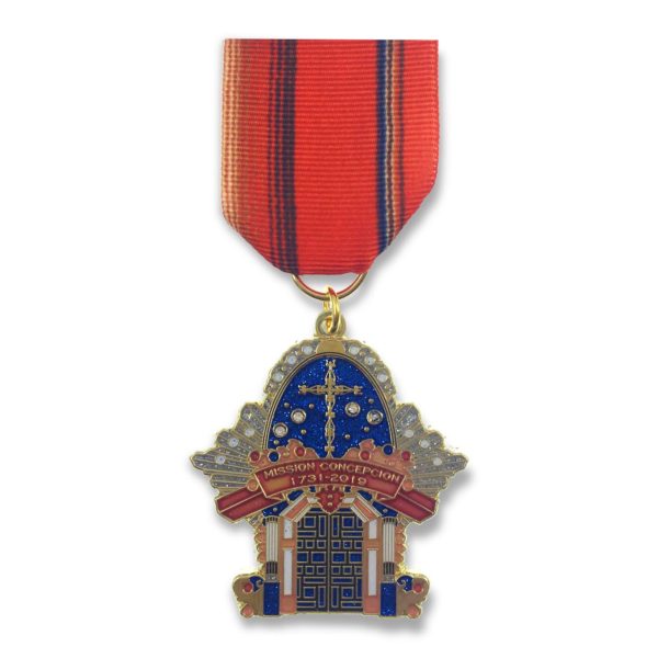 A medal with a church on it