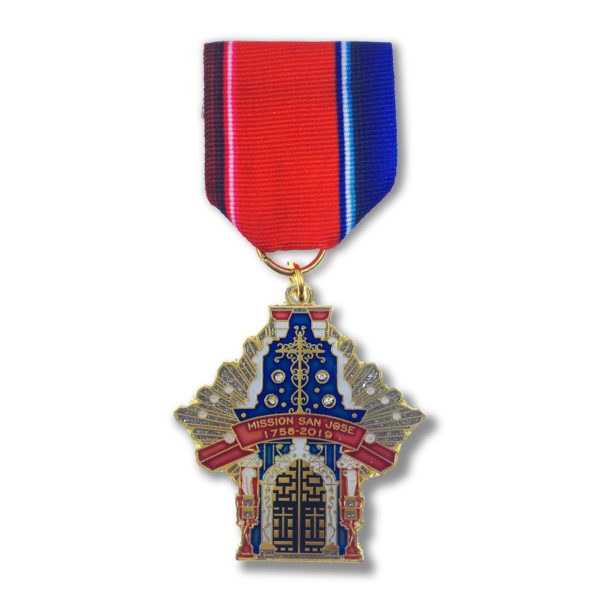 A medal with a church on it