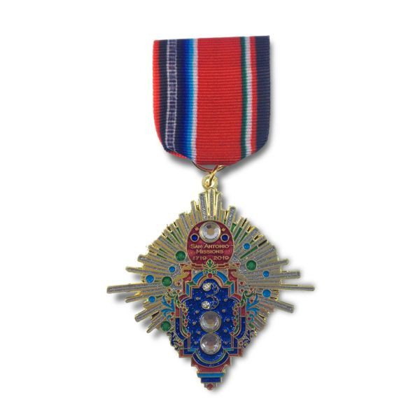 A medal with a blue and red ribbon on it.