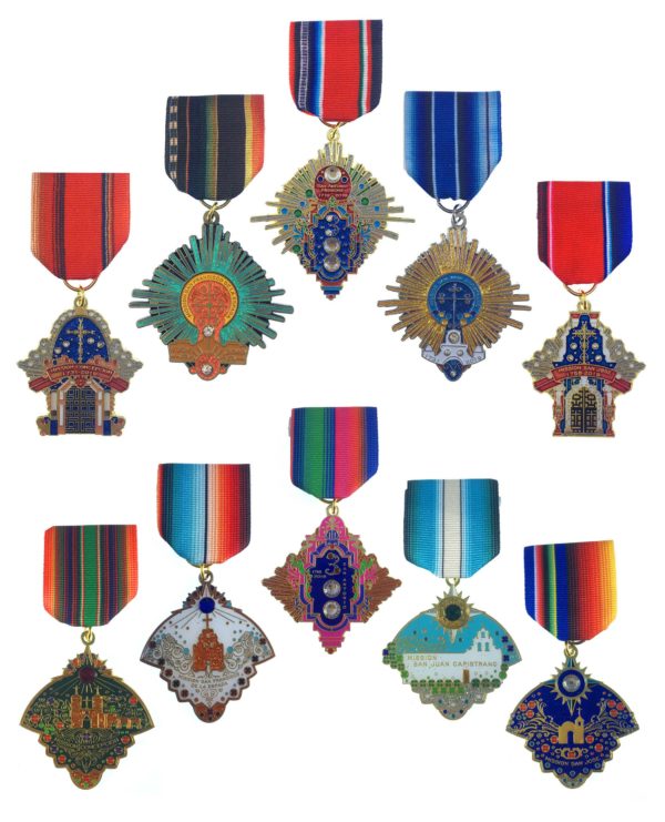 A group of medals with different designs on them.