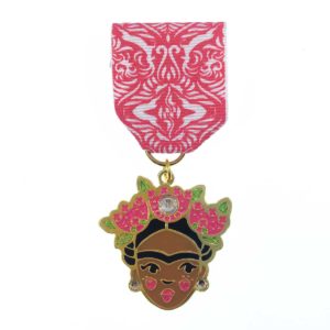 A medal with a woman 's face on it.