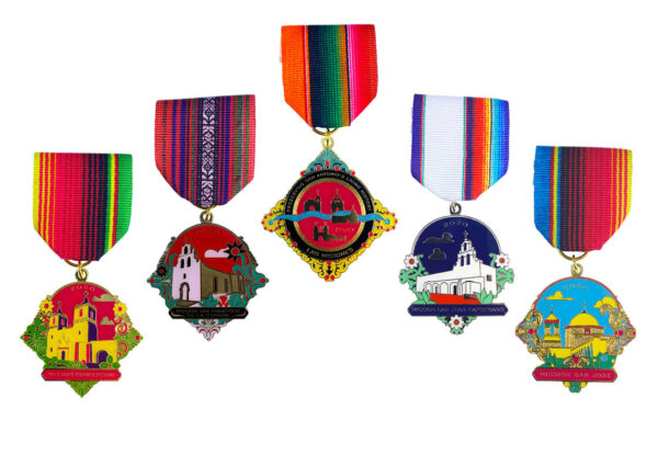 A row of medals with different designs on them.